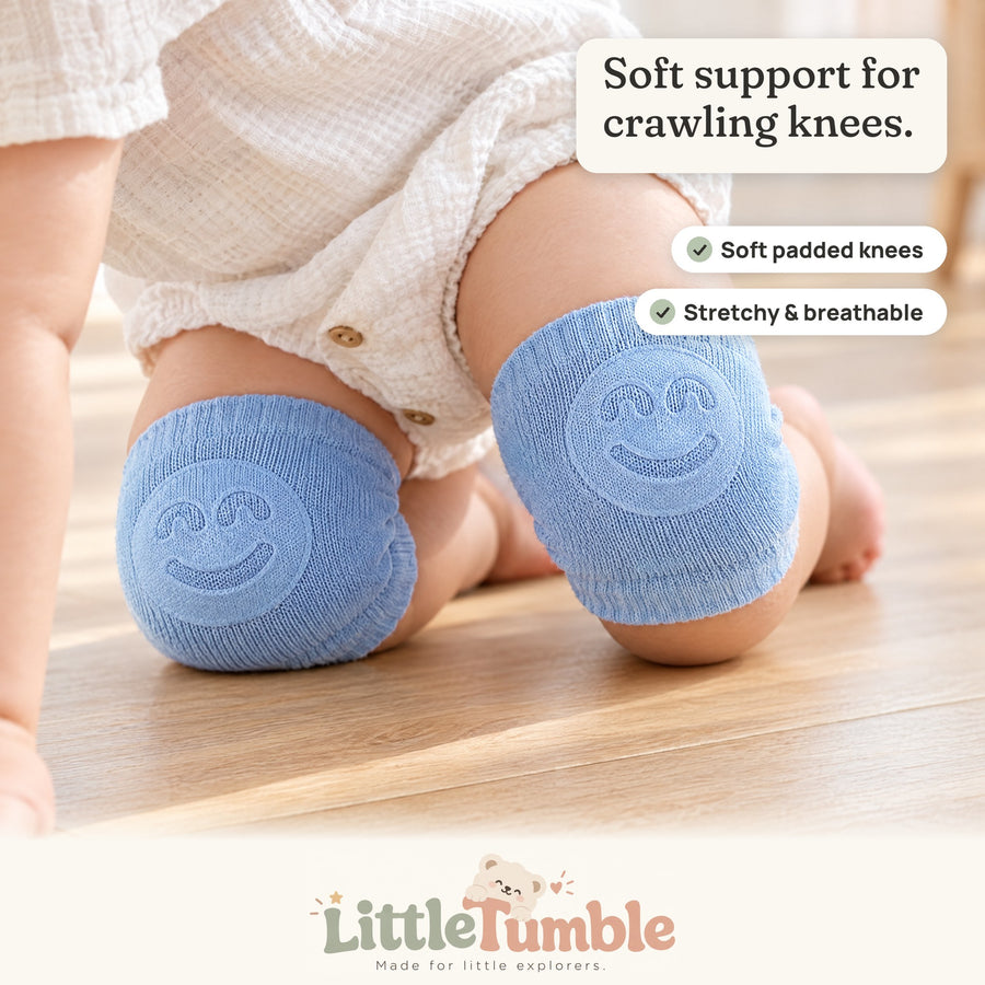 Baby crawling in soft blue KneeGuards