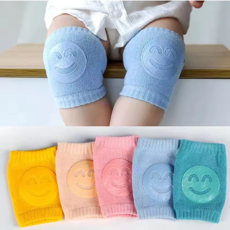 Baby wearing soft blue LittleTumble KneeGuards